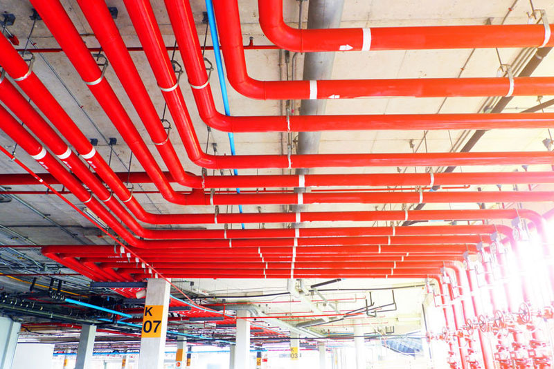 red-sprinkler-system-plumbing-pipes